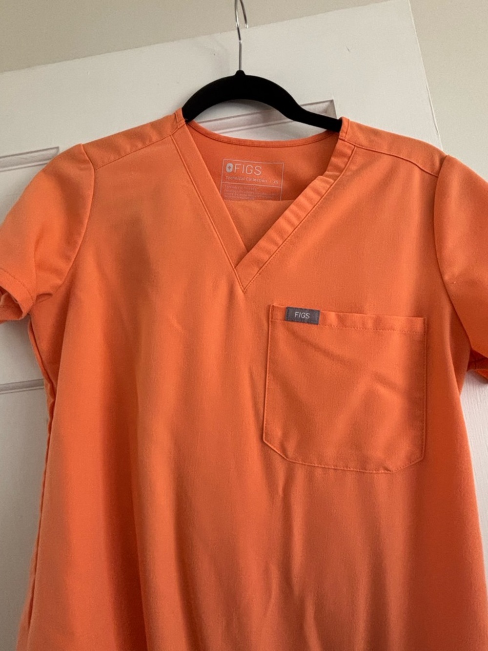 FIGS women’s Short Sleeve V-Neck Top in Bright Orange